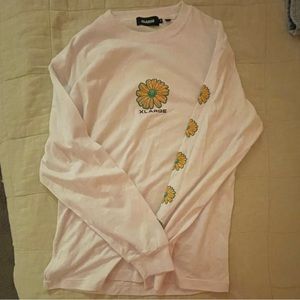 long sleeve with sunflower design and logo, brand is X-large